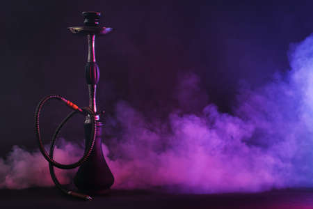 Hookah with fume on dark backgroundの写真素材