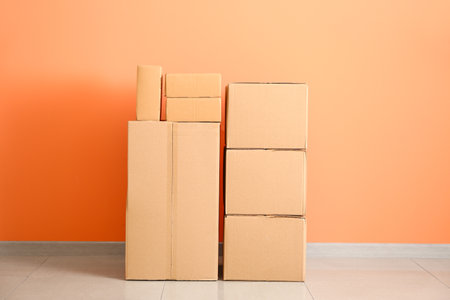 Cardboard boxes near color wall