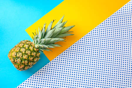 Ripe pineapple on color backgroundの写真素材