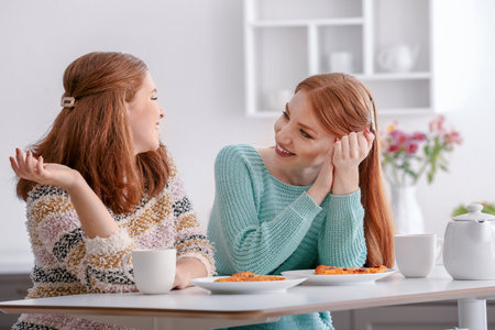 Beautiful young women resting together at home