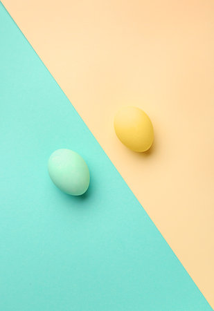 Beautiful Easter eggs on color backgroundの写真素材