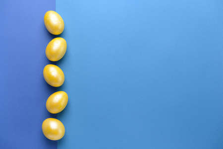 Beautiful Easter eggs on color backgroundの写真素材