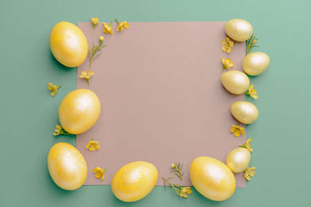 Beautiful Easter eggs and blank card on color background