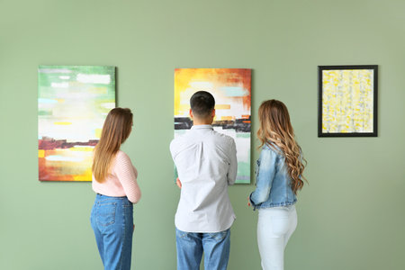 People at exhibition in modern art gallery