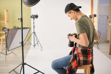 Teenage photographer in professional studioの写真素材