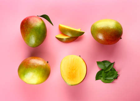 Tasty fresh mango on color backgroundの写真素材
