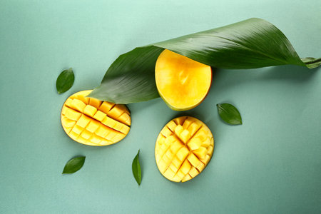 Tasty fresh mango on color backgroundの写真素材