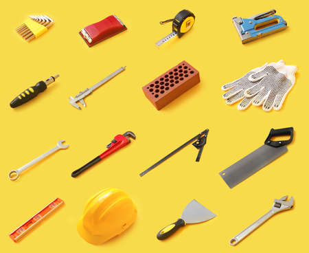 Set of construction tools on color background
