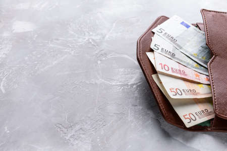 Wallet with euro banknotes on grunge backgroundの写真素材