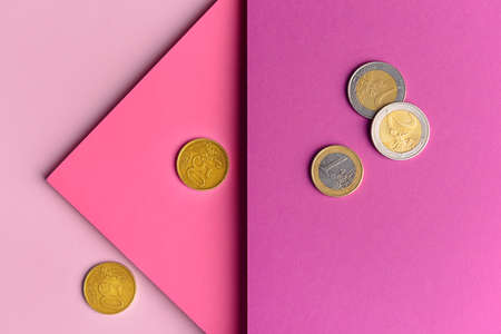Paper sheets with coins on color backgroundの写真素材