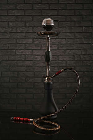 Hookah on dark brick background