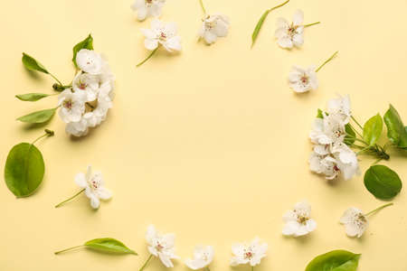 Frame made of beautiful flowers on color backgroundの写真素材