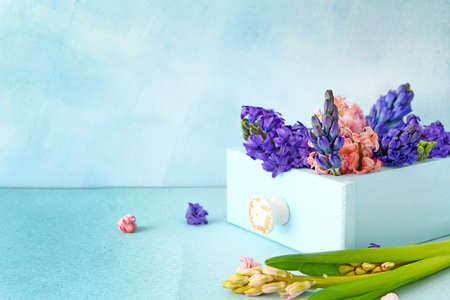 Box with beautiful hyacinth flowers on tableの写真素材