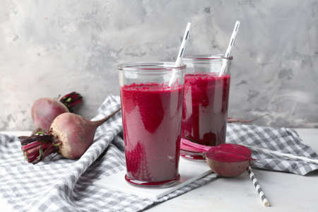 Glasses of fresh beet smoothie on table
