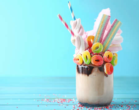 Delicious freak shake on color wooden tableの写真素材