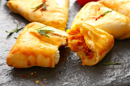 Delicious vegetable samosas on slate plate, closeup