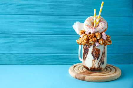 Delicious freak shake on color wooden backgroundの写真素材