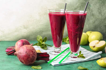 Glasses of fresh beet smoothie on table