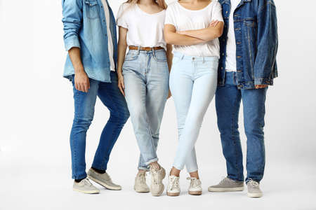 Stylish young people in jeans clothes on white backgroundの写真素材