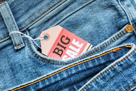Stylish jeans with tag "Big Sale", closeupの写真素材