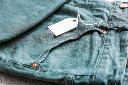 Stylish jeans with tag closeupの写真素材