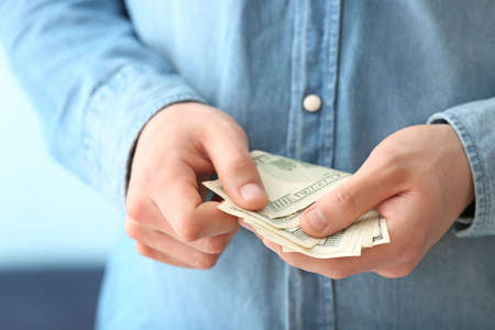 Woman with dollar banknotes, closeup