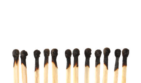 Burnt out matches on white background