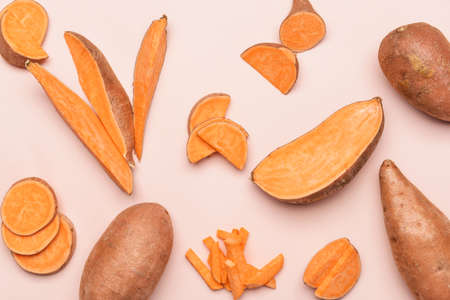 Fresh sweet potatoes on light backgroundの写真素材