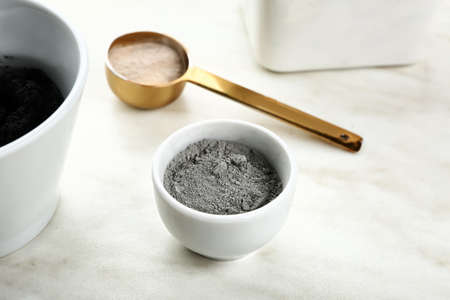 Cosmetic clay in bowl on light backgroundの写真素材