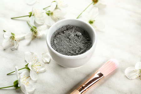 Cosmetic clay in bowl on light backgroundの写真素材