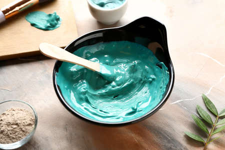 Bowl with cosmetic clay on tableの写真素材