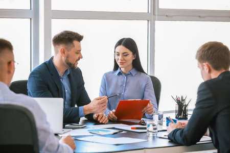 Team of business people during meeting in office