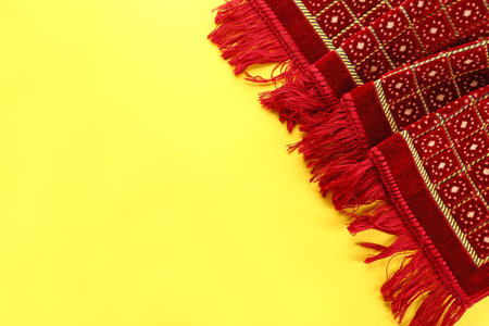 Muslim prayer rug on color backgroundの写真素材