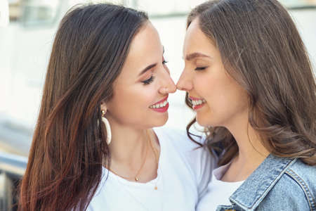 Happy lesbian couple walking outdoors