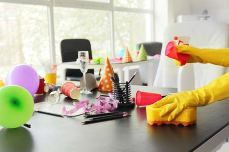 Janitor cleaning room after party