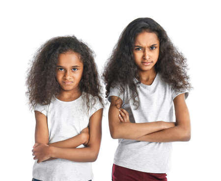 Offended African-American girls on white background