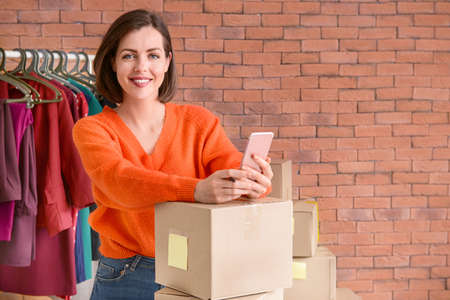 Female owner of online shopping site preparing order for client