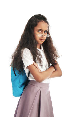 Displeased African-American schoolgirl on white backgroundの写真素材