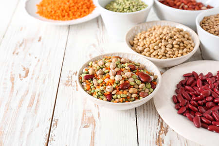 Assortment of legumes on white table