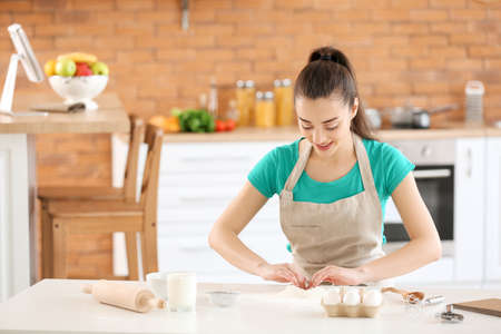 Beautiful woman preparing bakery in kitchen at home