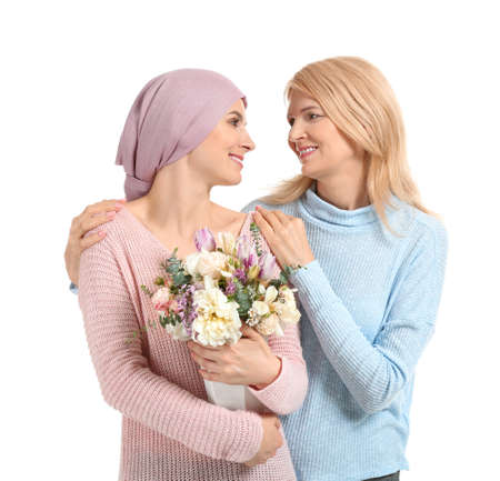 Mother greeting her daughter after successful treatment on white backgroundの写真素材