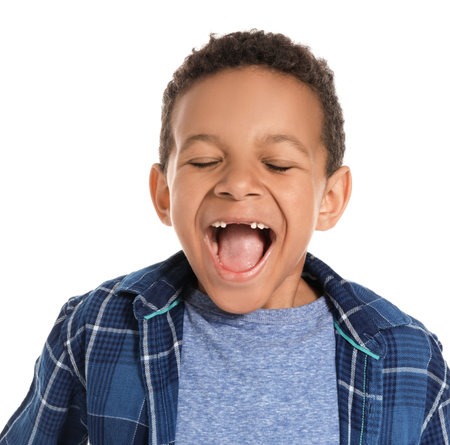 Happy African-American boy on white backgroundの写真素材