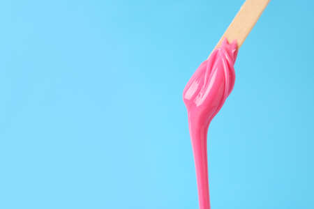 Stick with sugaring paste on color backgroundの写真素材