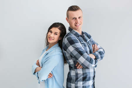 Adorable loving couple on gray background