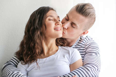 Adorable loving couple resting at home
