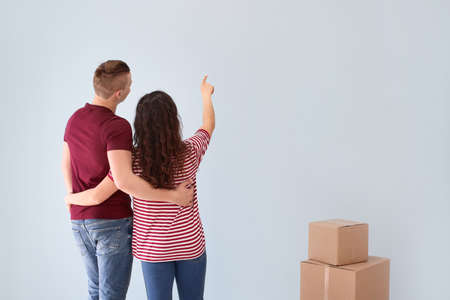 Adorable loving couple after moving into new house