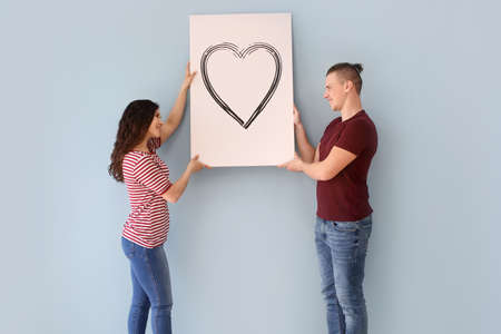 Adorable loving couple after moving into new houseの写真素材