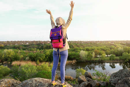 Female tourist in mountains on spring dayの写真素材