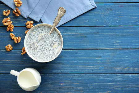 Bowl with tasty chia dessert on wooden tableの写真素材