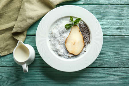 Bowl with tasty chia dessert on wooden tableの写真素材